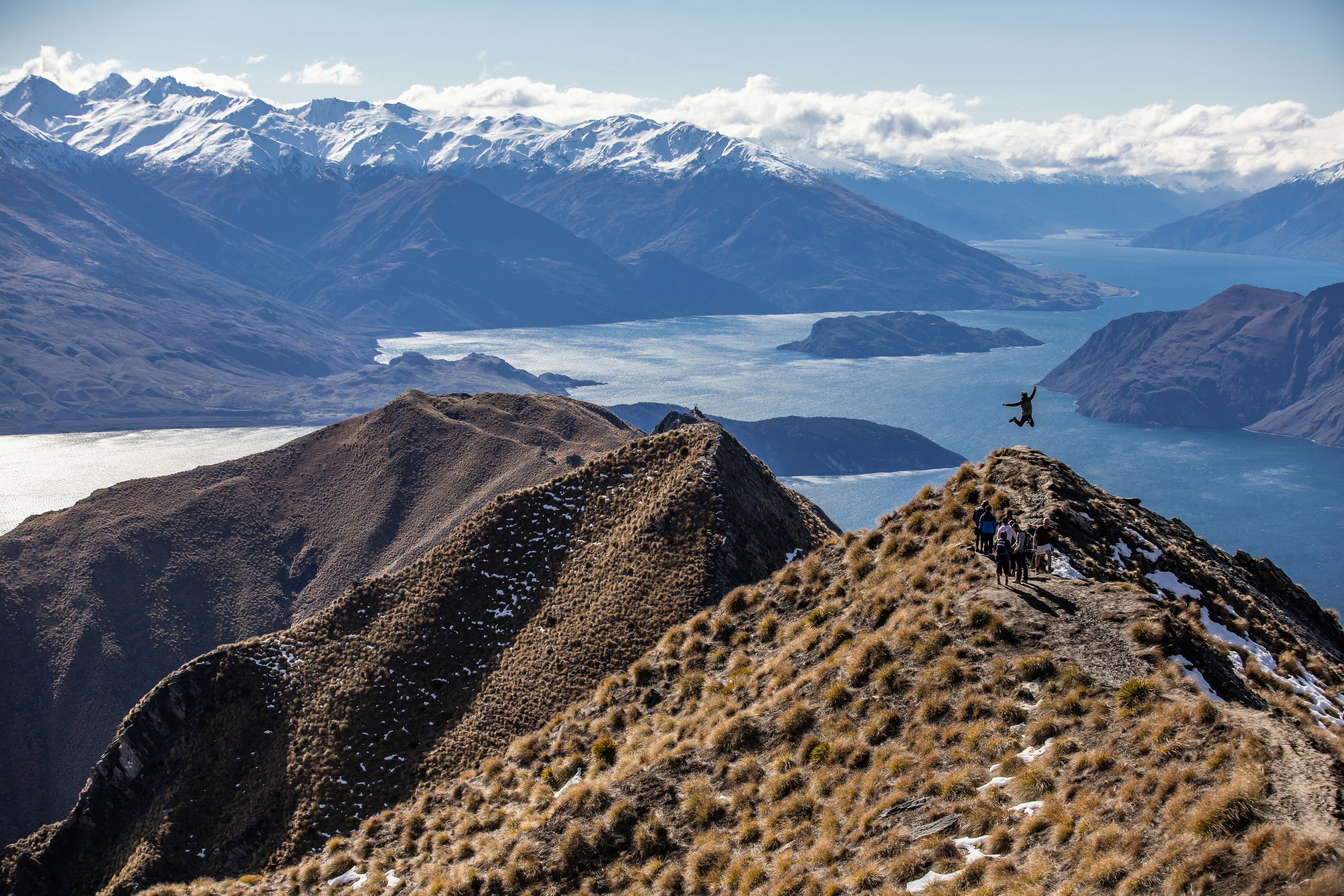 Hiker jumping for joy in the Wanaka valley